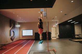 Athlete at peak of countermovement jump during P3 assessment