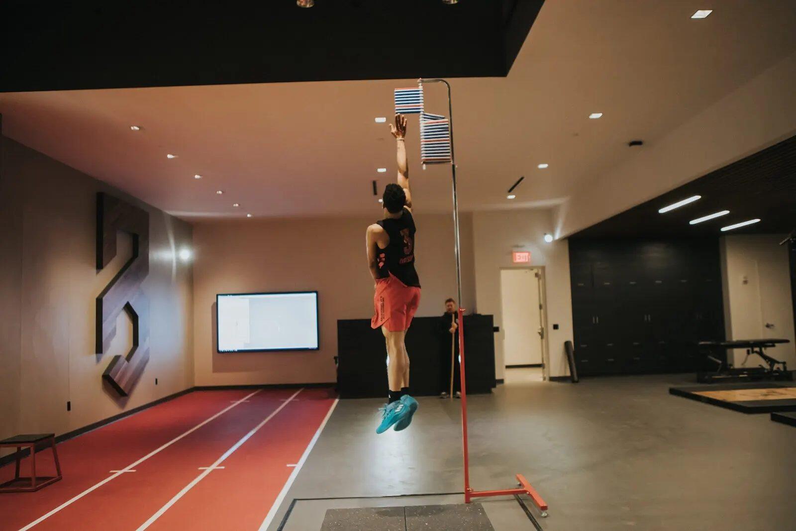 Athlete at peak of countermovement jump during P3 assessment